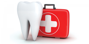 tooth next to a first aid kit